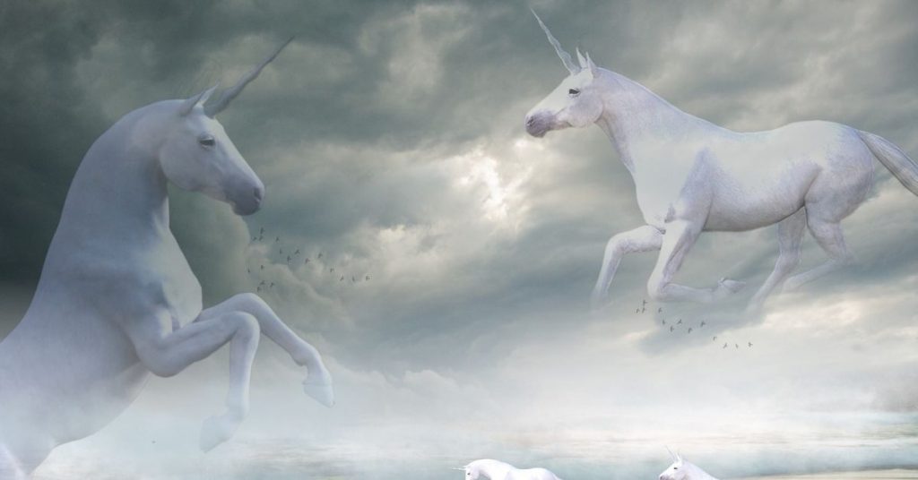 Unicorns and the Bible - Two White Unicorns in Cloudy Sky