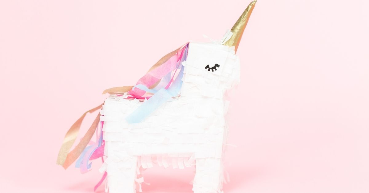 How to Celebrate National Unicorn Day - A Unicorn Pinata on Pink Background