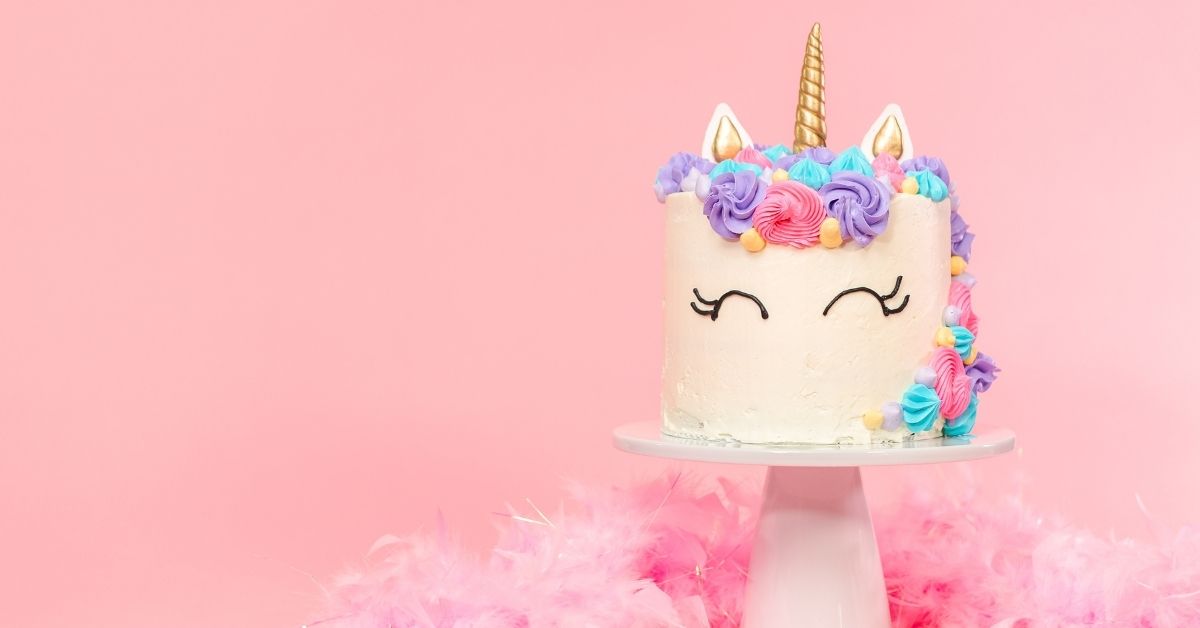 Unicorn Cake Decorating Ideas - a Unicorn Cake on Pink Background
